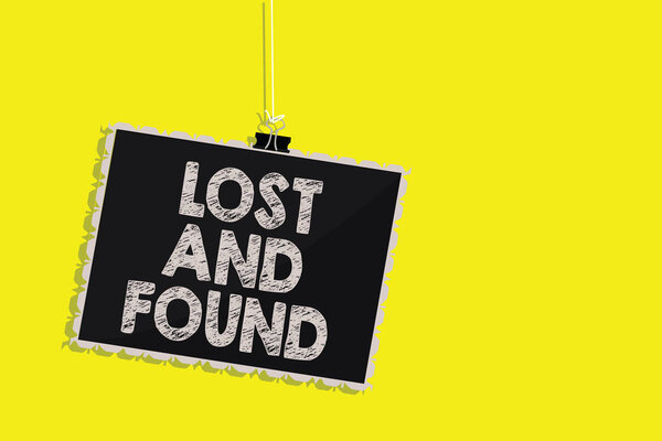 Writing note showing Lost And Found. Business photo showcasing Place where you can find forgotten things Search service Hanging blackboard message communication sign yellow background