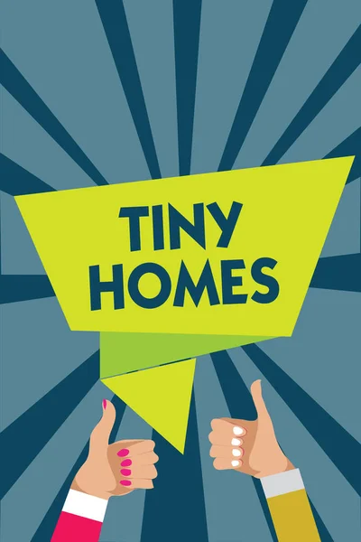 Handwriting text writing Tiny Homes. Concept meaning houses contain one room only or two and small entrance Cheap Man woman hands thumbs up approval speech bubble origami rays background