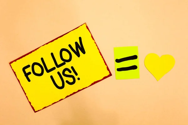 Conceptual hand writing showing Follow Us. Business photo text Act of person to invite an individual or group to join his company Yellow paper reminder equal sign heart sending romantic feelings