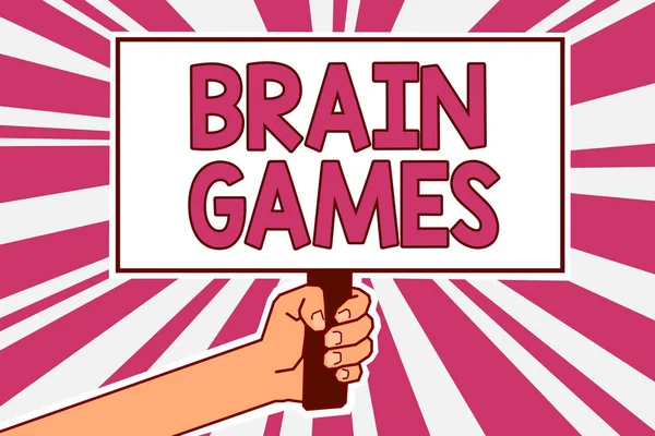 Word writing text Brain Games. Business concept for psychological tactic to manipulate or intimidate with opponent Man hand holding poster important protest message pink rays background