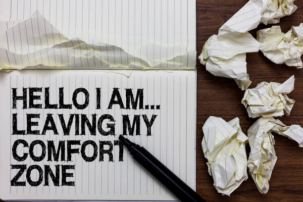 Handwriting text writing Hello I Am... Leaving My Comfort Zone. Concept meaning Making big changes Evolution Growth Marker over notebook crumpled papers ripped pages several tries mistakes