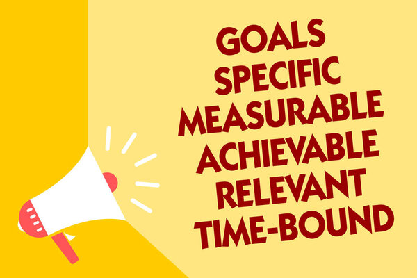 Text sign showing Goals Specific Measurable Achievable Relevant Time Bound. Conceptual photo Strategy Mission Megaphone loudspeaker yellow background important message speaking loud