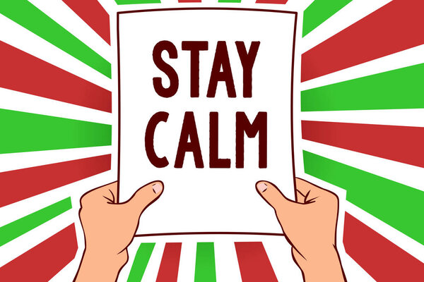Writing note showing Stay Calm. Business photo showcasing Maintain in a state of motion smoothly even under pressure Man holding paper important message remarkable red rays bright ideas