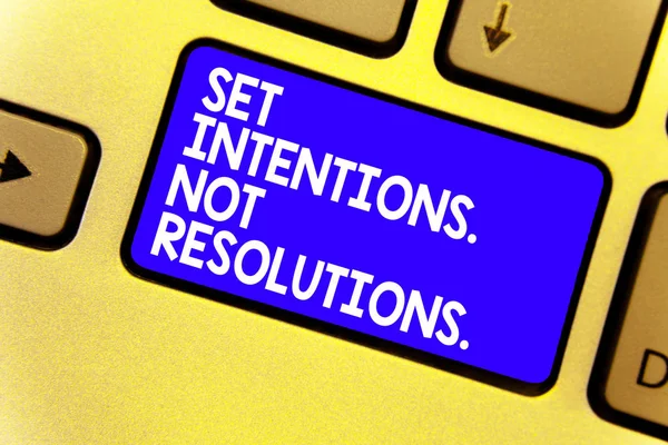 Word writing text Set Intentions. Not Resolutions.. Business concept for Positive choices for new start achieve goals Keyboard blue key Intention create computer computing reflection document