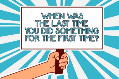 Conceptual hand writing showing When Was The Last Time You Did Something For The First Time question. Business photo text 0 Man hand holding poster important protest message blue background clipart