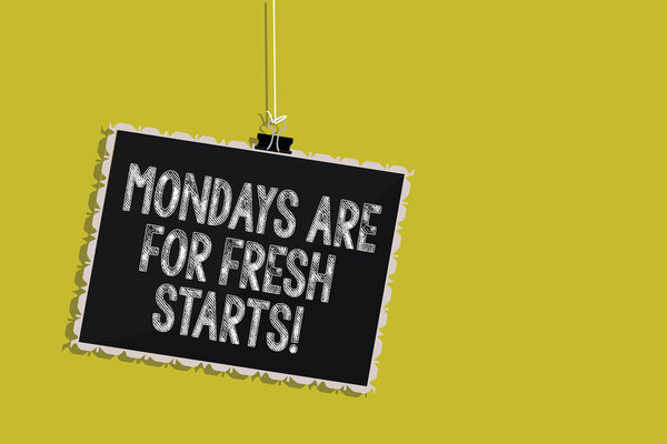 Handwriting text Mondays Are For Fresh Starts. Concept meaning Begin again every week have a good morning Hanging blackboard message communication information sign yellow background