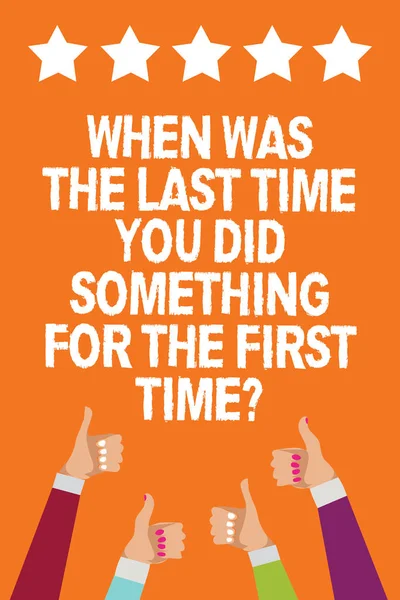 Word writing text When Was The Last Time You Did Something For The First Time question. Business concept for 0 Men women hands thumbs up approval five stars information orange background