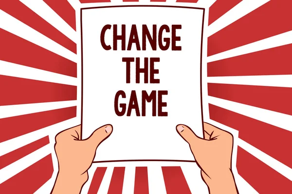 Handwriting text writing Change The Game. Concept meaning Make a movement do something different new strategies Man holding paper important message remarkable red rays enlighten ideas