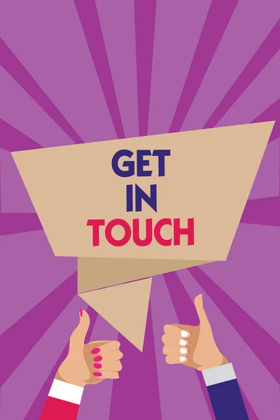 Writing note showing Get In Touch. Business photo showcasing Stay in contact Constant Communication Interaction Bonding Man woman hands thumbs up approval speech bubble rays background