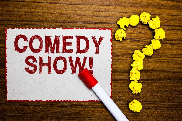 Text sign showing Comedy Show. Conceptual photo Funny program Humorous Amusing medium of Entertainment White paper marker crumpled papers forming question mark wooden background