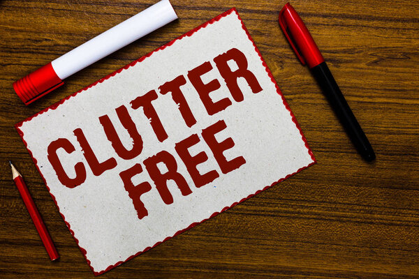 Handwriting text writing Clutter Free. Concept meaning Well organized and arranged Tidy All things in right places White paper red borders markers wooden background communicating ideas