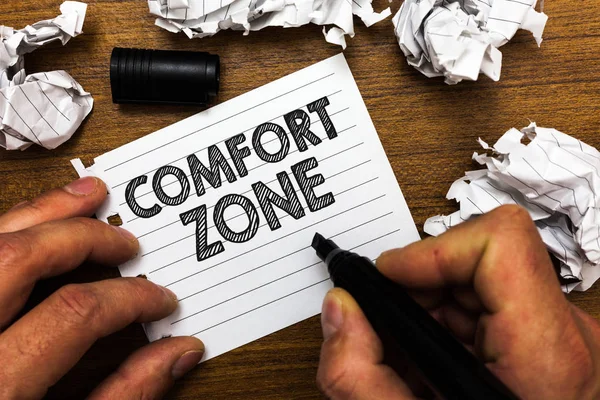 Text sign showing Comfort Zone. Conceptual photo A situation where one feels safe or at ease have Control Man holding marker notebook page crumpled papers several tries mistakes