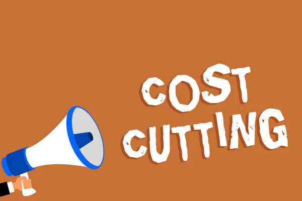 Text sign showing Cost Cutting. Conceptual photo Measures implemented to reduced expenses and improved profit Man holding megaphone loudspeaker orange background message speaking loud