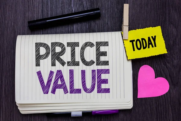 Text sign showing Price Value. Conceptual photo strategy which sets cost primarily but not exclusively Open notebook clothespin holding reminder marker heart wooden background