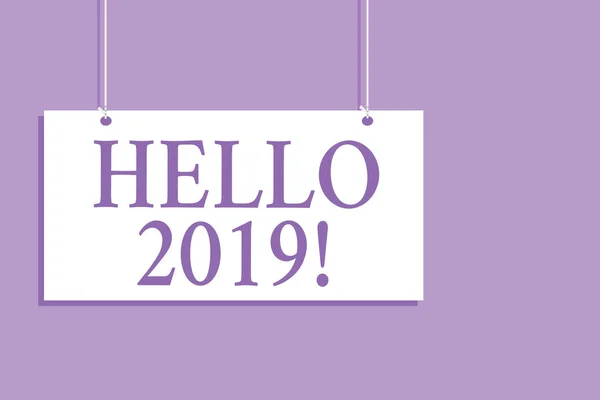 Writing note showing Hello 2019. Business photo showcasing expression or gesture of greeting answering the telephone Hanging board message communication open close sign purple background