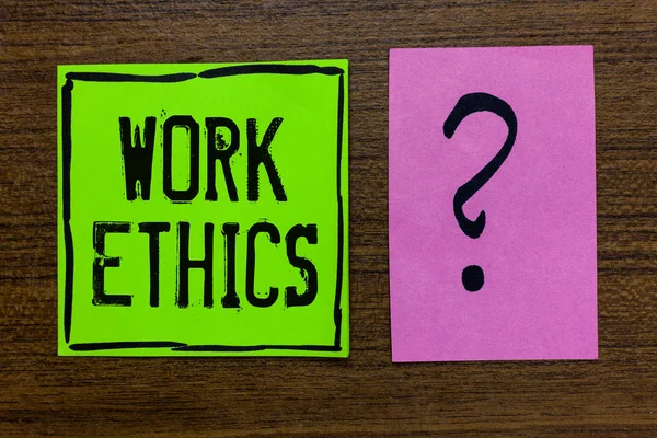 Handwriting text Work Ethics. Concept meaning A set of values centered on the importance of doing work Green paper note Important reminder pink question mark wooden background