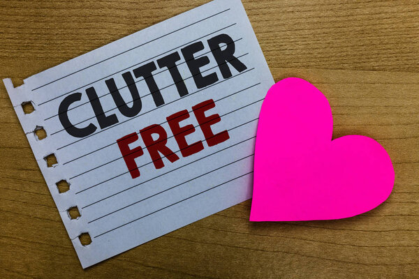 Conceptual hand writing showing Clutter Free. Business photo showcasing Well organized and arranged Tidy All things in right places Notebook paper Romantic ideas heart feelings Wooden table