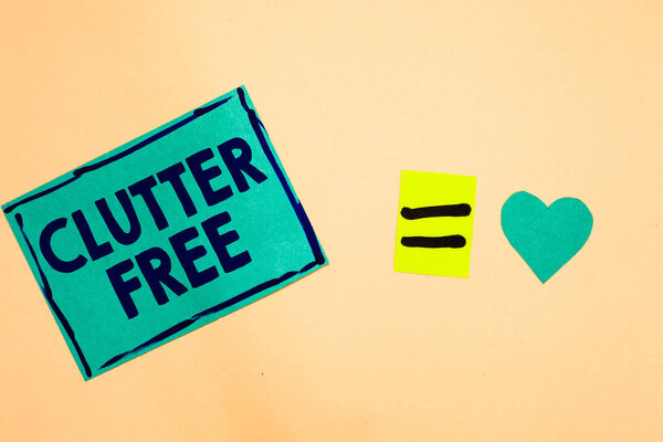 Text sign showing Clutter Free. Conceptual photo Well organized and arranged Tidy All things in right places Turquoise piece paper reminder equal sign heart sending romantic feelings