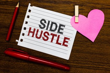 Word writing text Side Hustle. Business concept for way make some extra cash that allows you flexibility to pursue Notebook piece paper markers clothespin holding heart wooden background clipart
