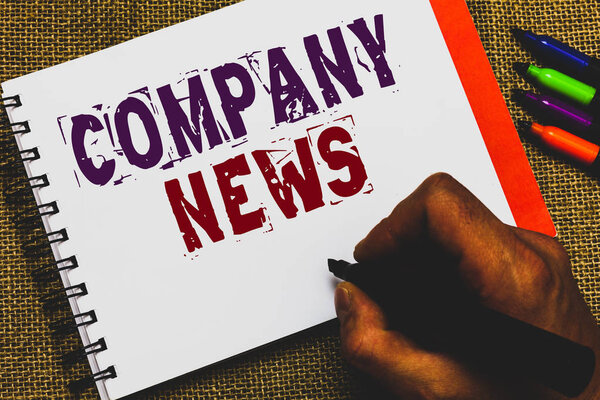 Word writing text Company News. Business concept for Latest Information and happening on a business Corporate Report Man hand holding marker notebook paper communicating ideas Jute background