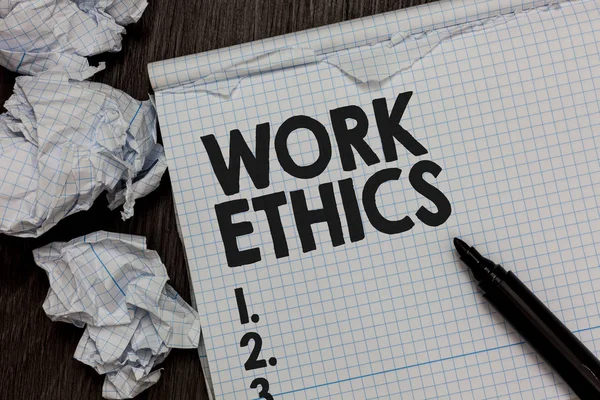 Text sign showing Work Ethics. Conceptual photo A set of values centered on the importance of doing work Marker over notebook crumpled papers ripped pages several tries mistakes