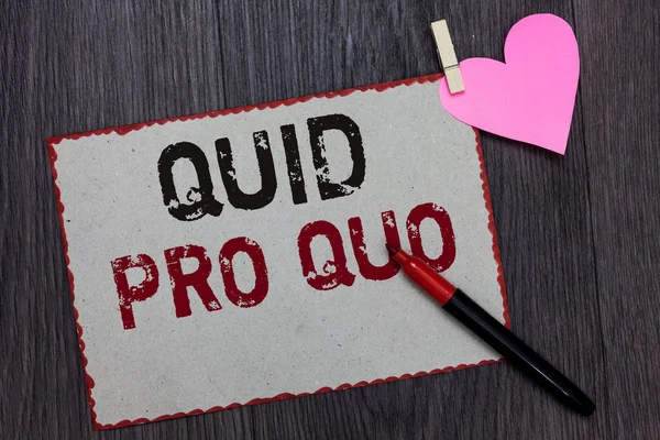 Text sign showing Quid Pro Quo. Conceptual photo A favor or advantage granted or expected in return of something White page red borders marker clothespin holds paper heart wood background.