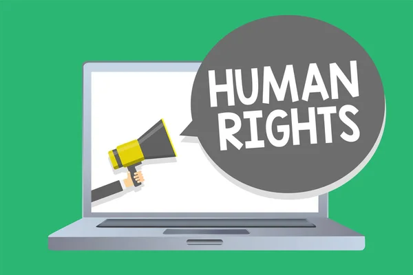 Text sign showing Human Rights. Conceptual photo Moral Principles Standards Norms of a people protected by Law Man holding megaphone loudspeaker speech bubble message speaking loud. — Stock Photo, Image