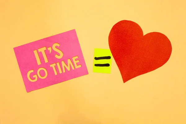 Word writing text It s is Go Time. Business concept for A period to undertake the assigned tasks Bring it ON Pink piece paper reminder equal sign red heart sending romantic feelings. — Stock Photo, Image