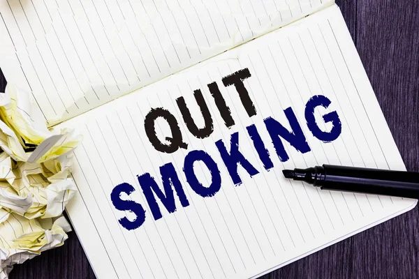 Conceptual hand writing showing Quit Smoking. Business photo text Discontinuing or stopping the use of tobacco addiction Marker over notebook crumpled papers several tries mistakes. — Stock Photo, Image