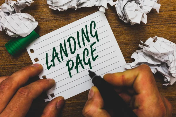 Conceptual hand writing showing Landing Page. Business photo text Website accessed by clicking a link on another web page Man holding marker notebook page crumpled papers several tries. — Stock Photo, Image
