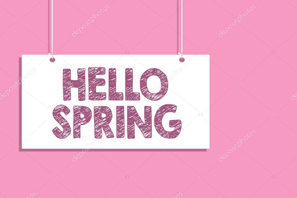 Conceptual hand writing showing Hello Spring. Business photo text Welcoming the season after the winter Blossoming of flowers Hang board communicate information open close sign pink background.