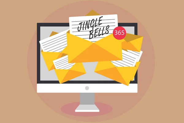 Texte d'écriture de mots Jingle Bells. Concept d'affaires pour la chanson de Noël traditionnelle la plus célèbre partout dans le monde Ordinateur recevant des e-mails enveloppes de messages importants avec des papiers virtuels . — Photo