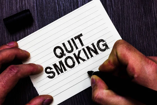 Text sign showing Quit Smoking. Conceptual photo Discontinuing or stopping the use of tobacco addiction Man holding marker notebook page communicate ideas Wooden background. — Stock Photo, Image