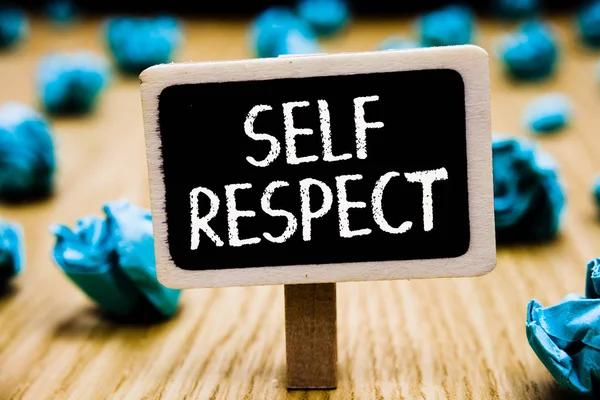 Handwriting text Self Respect. Concept meaning Pride and confidence in oneself Stand up for yourself Blackboard crumpled papers several tries mistake not satisfied wooden floor.