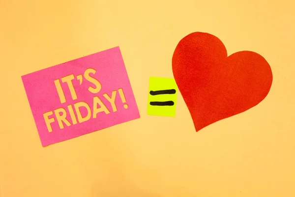 Word writing text It s is Friday. Business concept for Last day of the working week Before Saturday or weekends Pink piece paper reminder equal sign red heart sending romantic feelings. — Stock Photo, Image