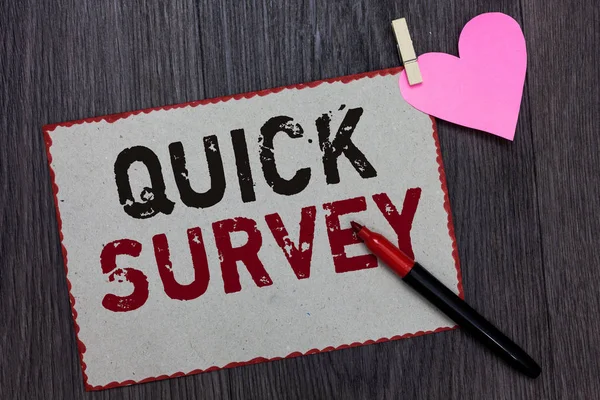 Text sign showing Quick Survey. Conceptual photo Conduct fast check on condition value situation of something White page red borders marker clothespin holds paper heart wood background.