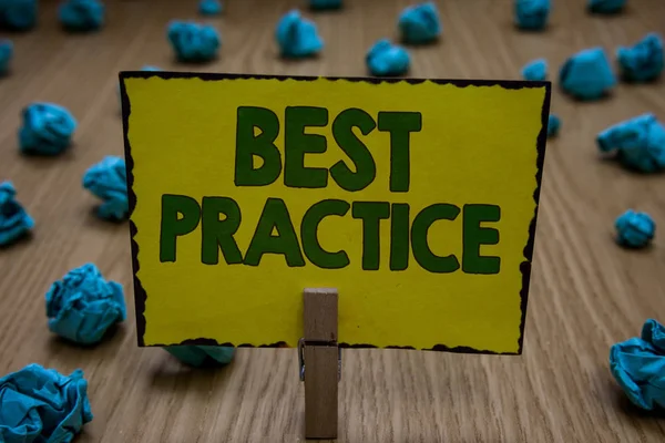 Text sign showing Best Practice. Conceptual photo Method Systematic Touchstone Guidelines Framework Ethic Clothespin holding yellow paper note crumpled papers several tries mistakes. — Stock Photo, Image