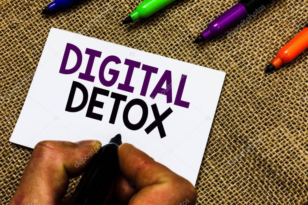 Writing note showing Digital Detox. Business photo showcasing Free of Electronic Devices Disconnect to Reconnect Unplugged Man hand holding marker white paper communicating idea Jute background.