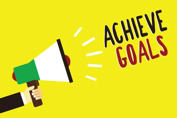 Text sign showing Achieve Goals. Conceptual photo Results oriented Reach Target Effective Planning Succeed Man holding megaphone loudspeaker yellow background message speaking loud. — Stock Photo, Image