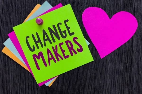 Text sign showing Change Makers. Conceptual photo Young Turk Influencers Acitivists Urbanization Fashion Gen X Papers Romantic lovely message Heart Good feelings Wooden background.