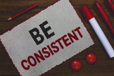 Kavramsal el olmak tutarlı gösterilen yazma. İş fotoğraf Tekdüzen kalıcı firma değiştirilemez bile değişmeyen Rapport beyaz kağıt kırmızı vitrine belirteçleri kalemleri ahşap arka plan sınırları.