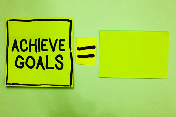 Word writing text Achieve Goals. Business concept for Results oriented Reach Target Effective Planning Succeed Green paper notes reminders equal sign important messages to remember.