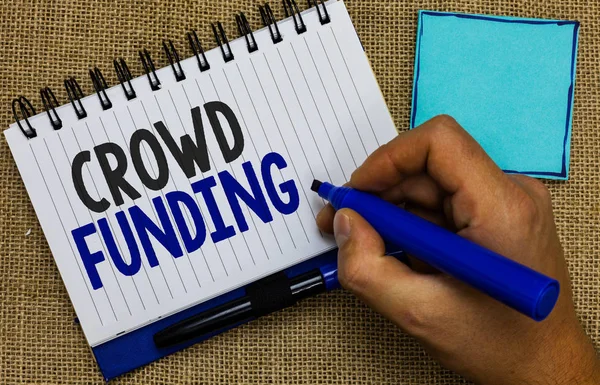 Word writing text Crowd Funding. Business concept for Fundraising Kickstarter Startup Pledge Platform Donations Man holding marker notebook page reminder communicate ideas Jute background. — Stock Photo, Image