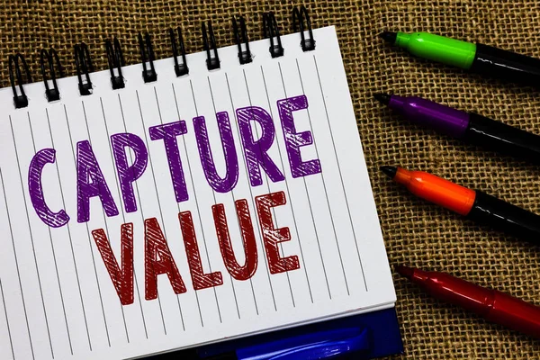 Text sign showing Capture Value. Conceptual photo Customer Relationship Satisfy Needs Brand Strength Retention Open spiral notebook page jute background colorful markers Expressing ideas.