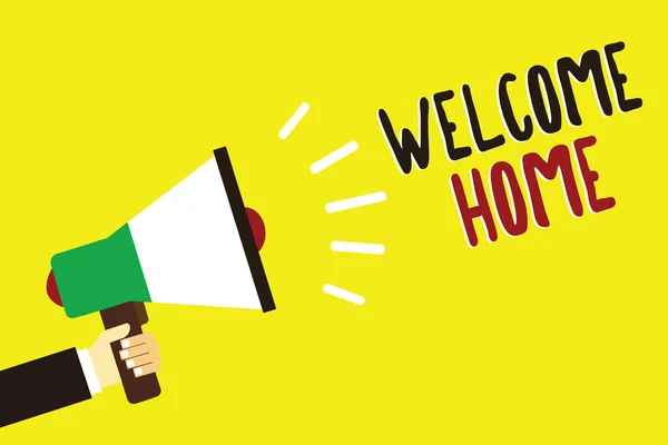 Text sign showing Welcome Home. Conceptual photo Expression Greetings New Owners Domicile Doormat Entry Man holding megaphone loudspeaker yellow background message speaking loud. — Stock Photo, Image