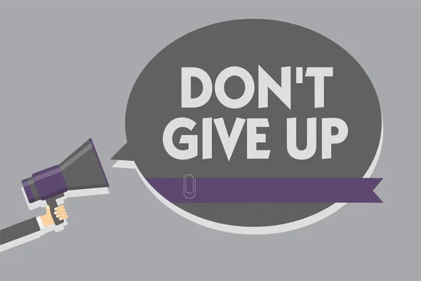 Text sign showing Don t not Give Up. Conceptual photo Determined Persevering Continue to Believe in Yourself Man holding megaphone loudspeaker speech bubble message speaking loud.