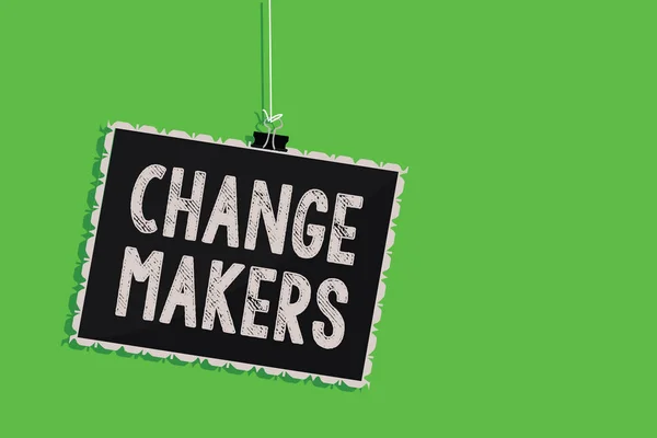 Text sign showing Change Makers. Conceptual photo Young Turk Influencers Acitivists Urbanization Fashion Gen X Hanging blackboard message communication information sign green background. — Stock Photo, Image