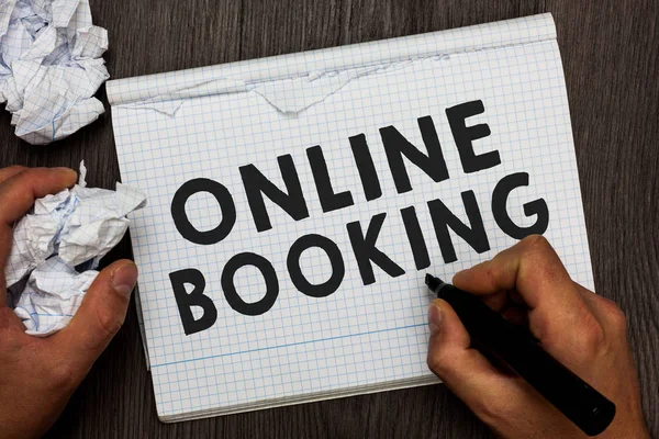 Writing note showing Online Booking. Business photo showcasing Reservation through internet Hotel accommodation Plane ticket Man holding marker notebook crumpled papers several tries made.