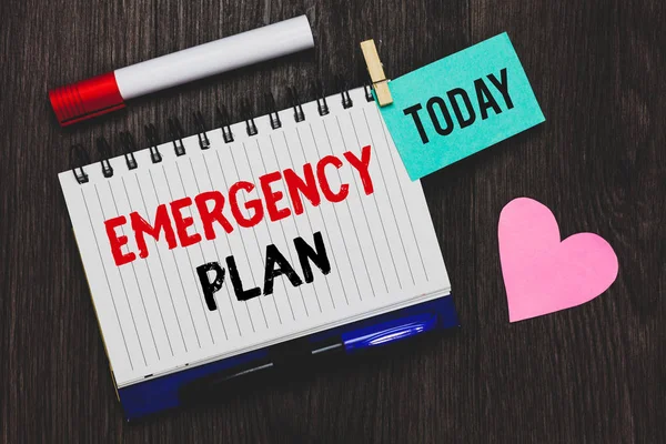 Writing note showing Emergency Plan. Business photo showcasing Procedures for response to major emergencies Be prepared Open notebook pin holding reminder marker heart wooden background. — Stock Photo, Image