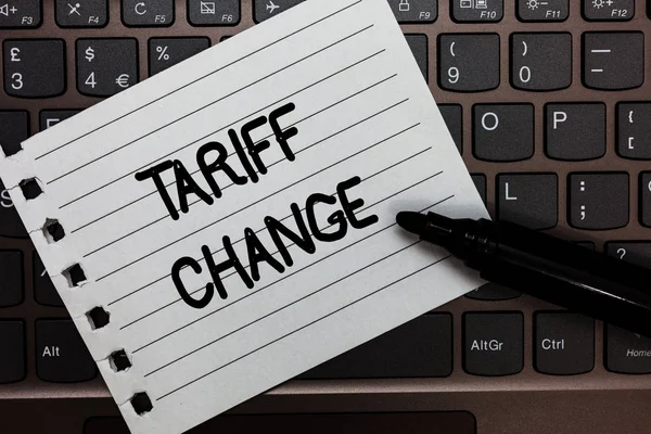 Text sign showing Tariff Change. Conceptual photo Amendment of Import Export taxes for goods and services Notebook piece paper keyboard Inspiration ideas Type computer black marker. — Stock Photo, Image